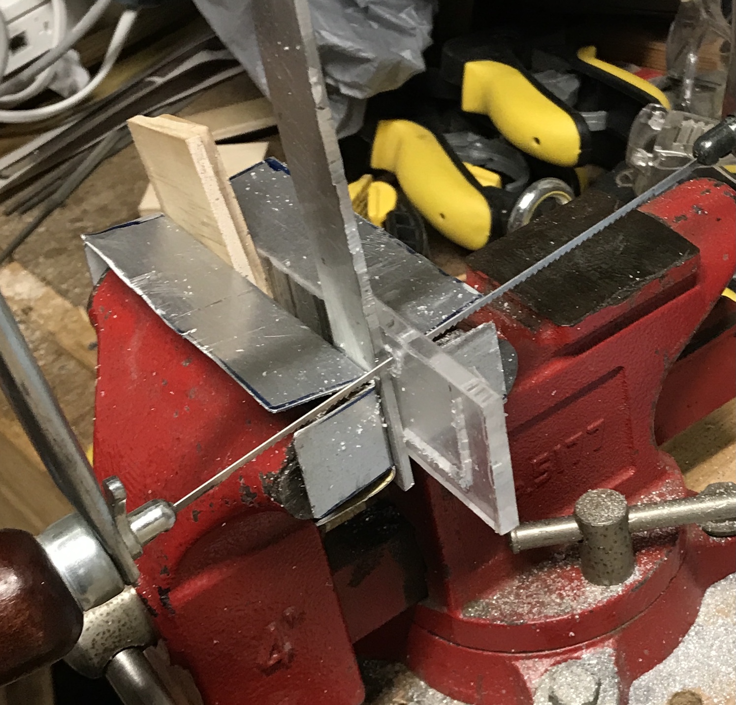 Cutting the lid opening with a coping saw